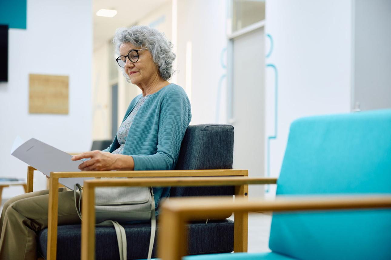 Adult reviewing written notes before a healthcare appointment